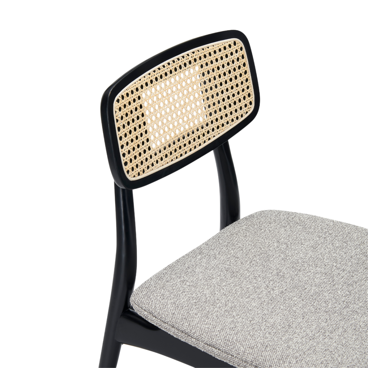 detail of Midcentury modern design dining chair with upholstered seat and rattan back detail