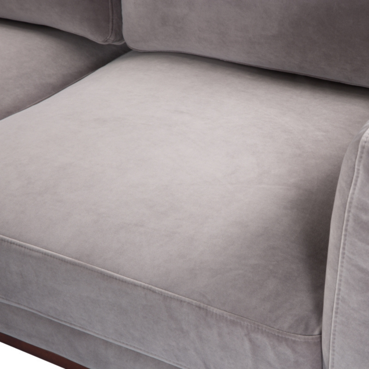 detail of simple modern 3 seater sofa in stone grey velvet upholstery